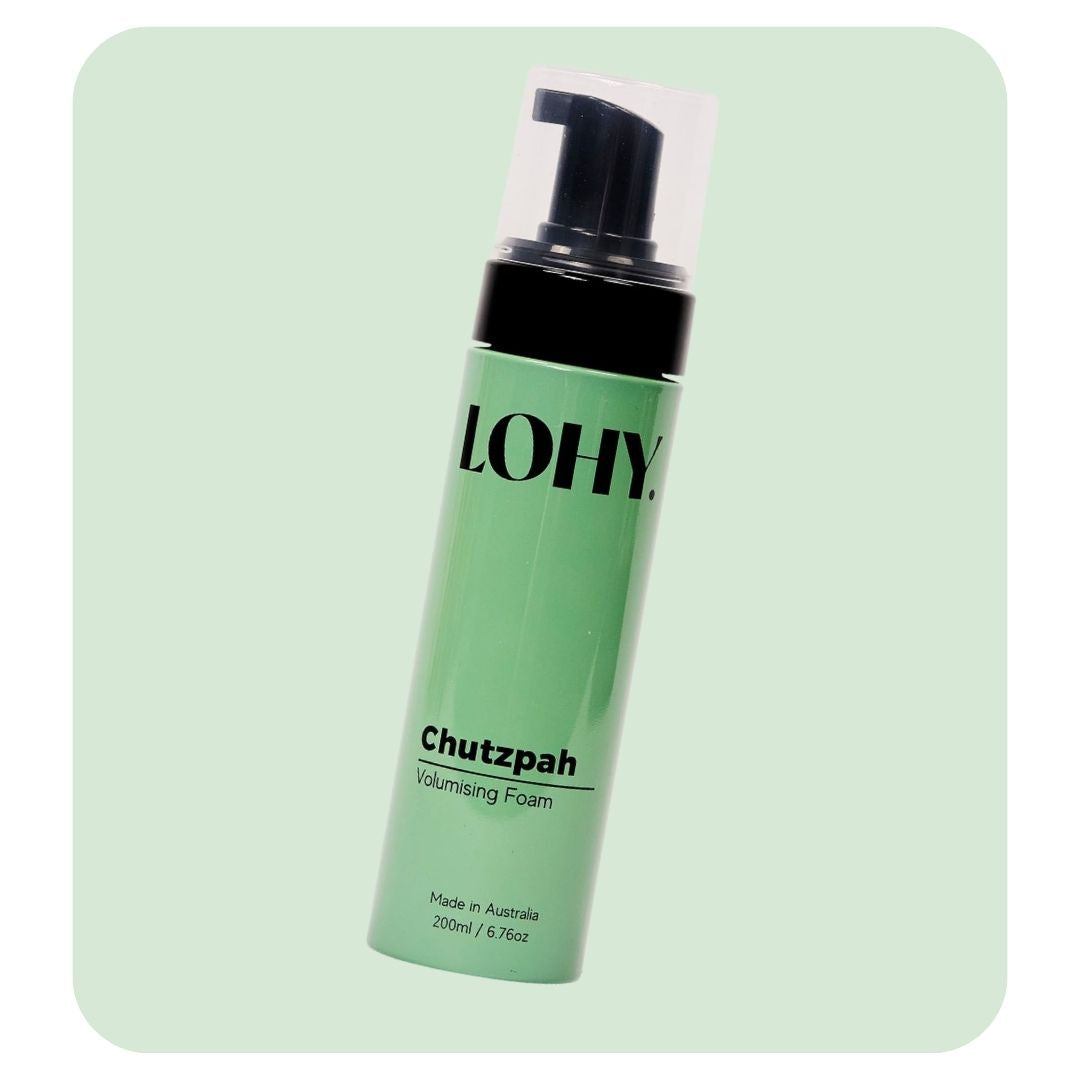 lohy chutzpah volumising foam 200ml bottle angled on a pastel green background