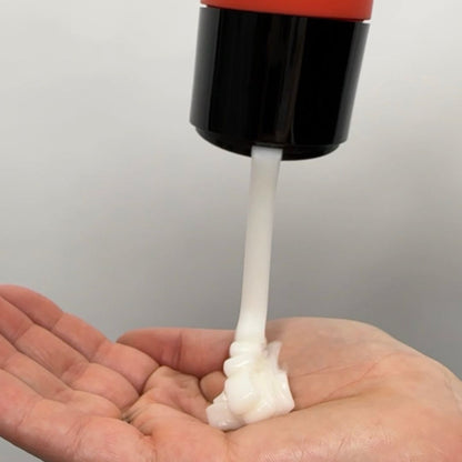 Curl mask being poured into palm of hand