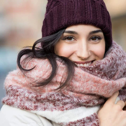 woman, wavy hair, smiling, cold winter