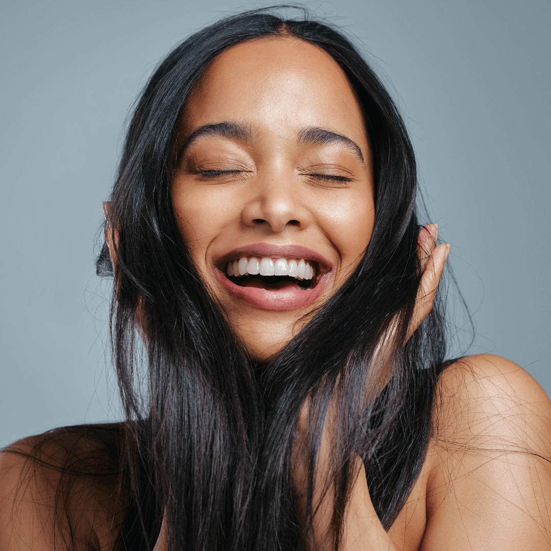 Lady happy scrunching long black hair