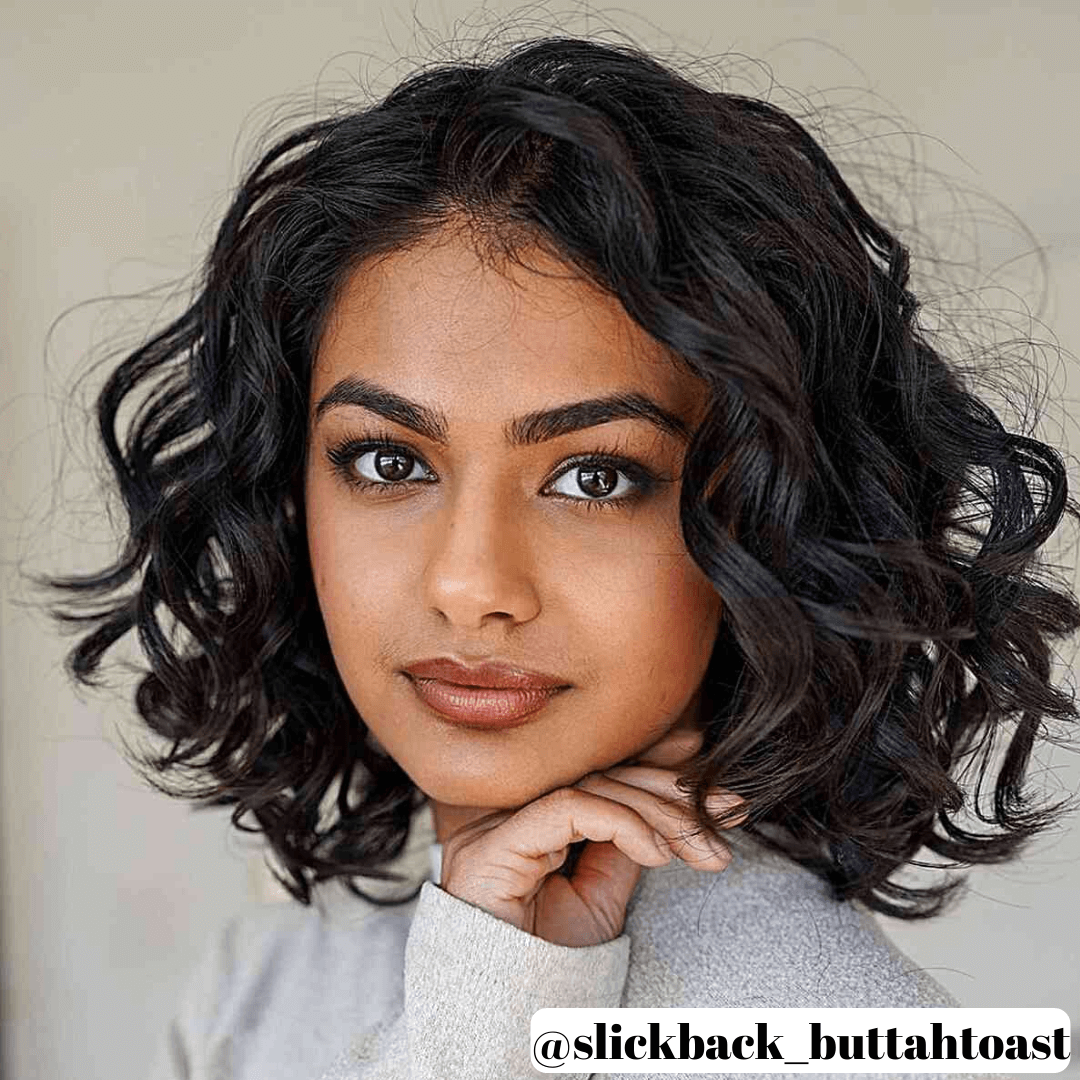 lady with short, black, curly hair