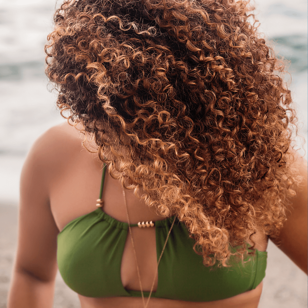 woman, curly brunette hair, beach