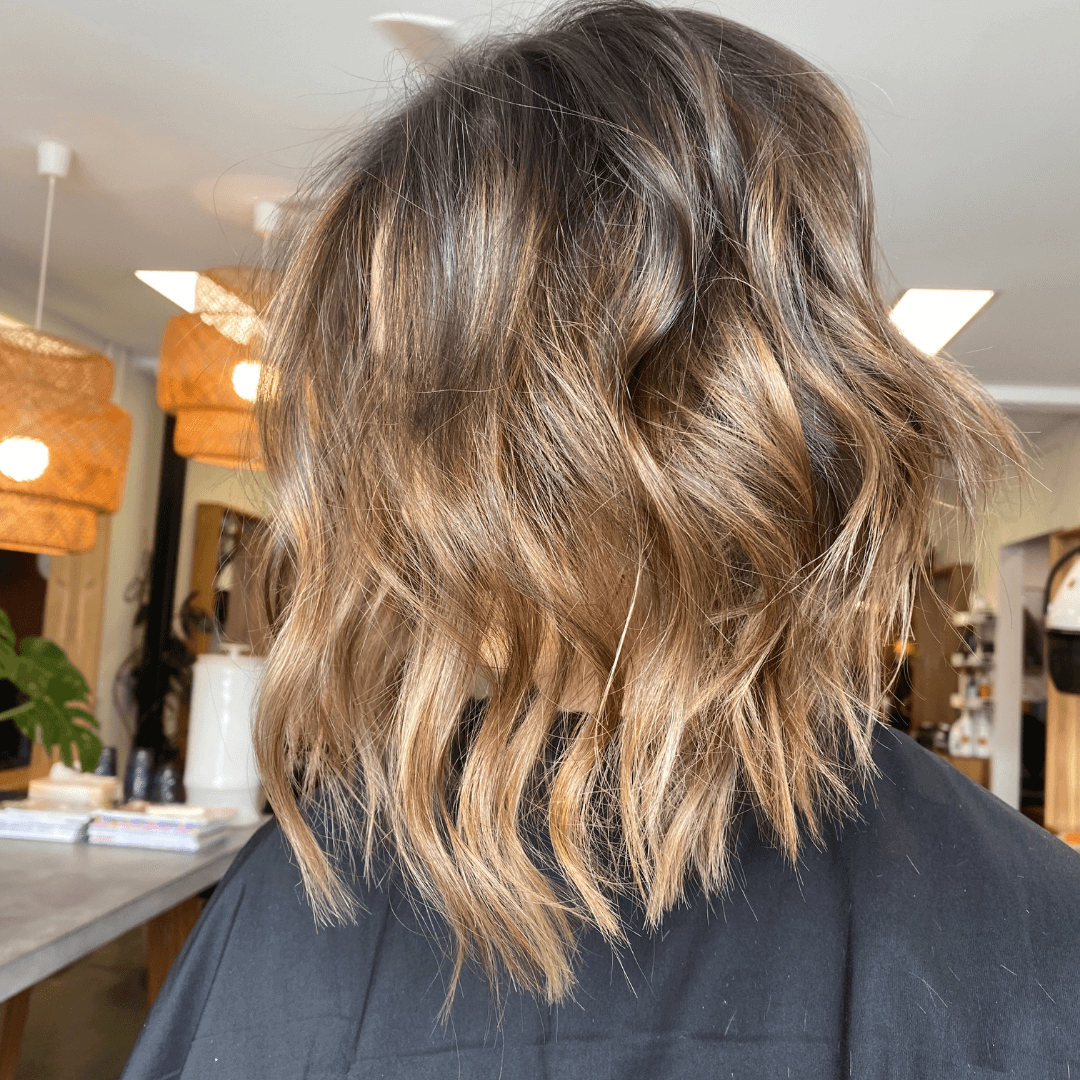 woman with short wavy brunette hair